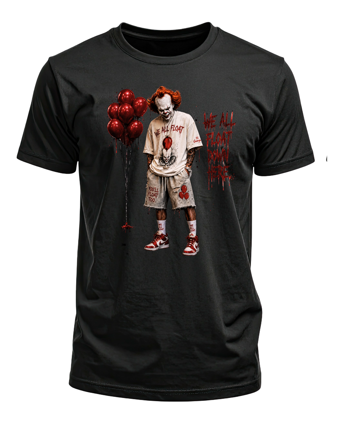 Black T-shirt featuring a red-haired horror clown beside red balloons and We All Float Down Here lettering